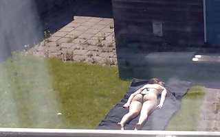 Sunbathing (Partly Topless)